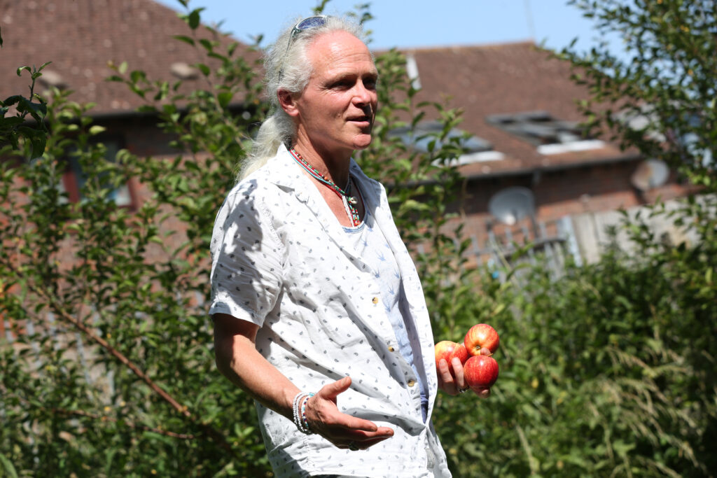 Steve Taylor doing a herbal story telling in community orchard